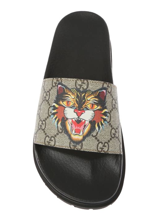 gucci tiger head slides.